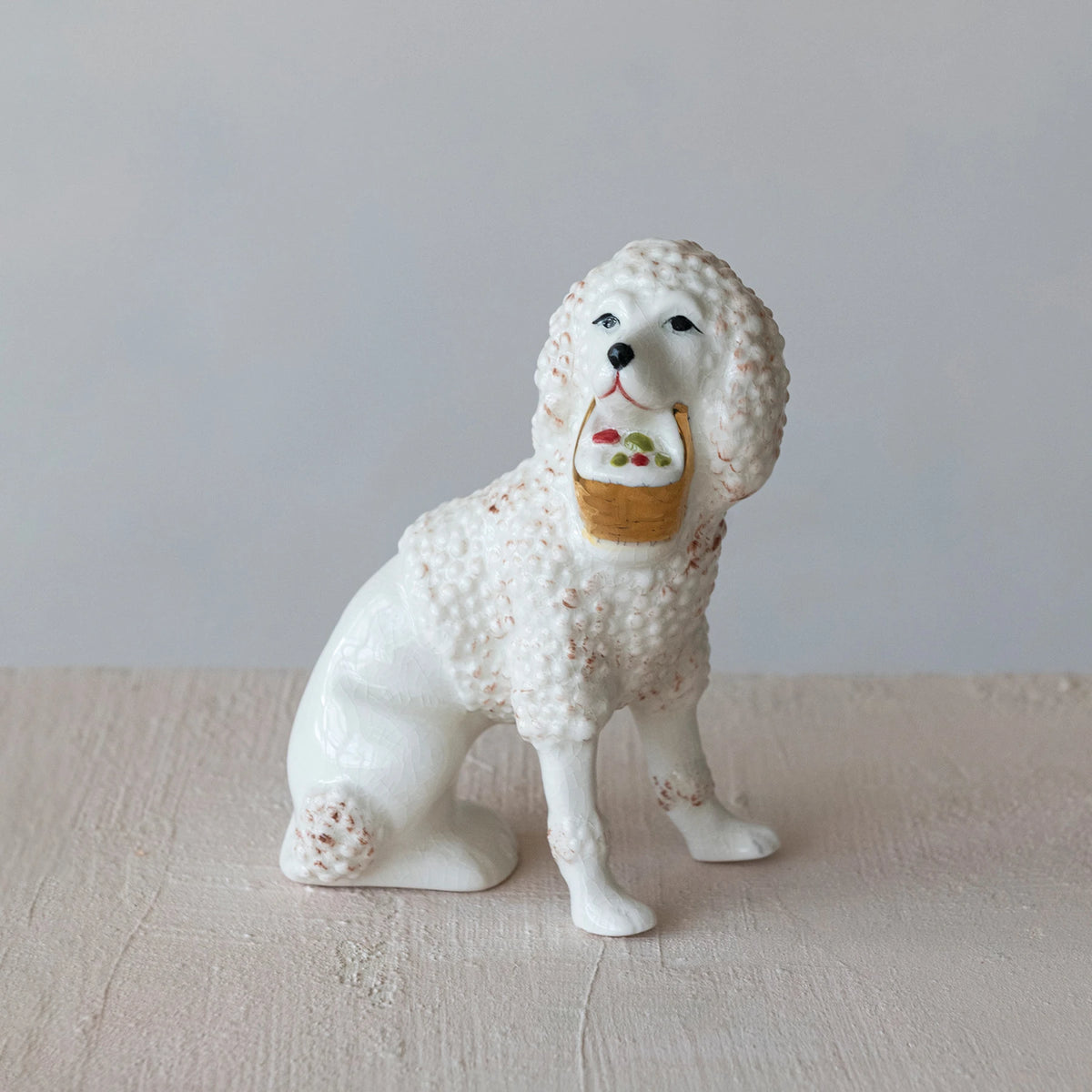 STAFFORDSHIRE POODLE W/BASKET